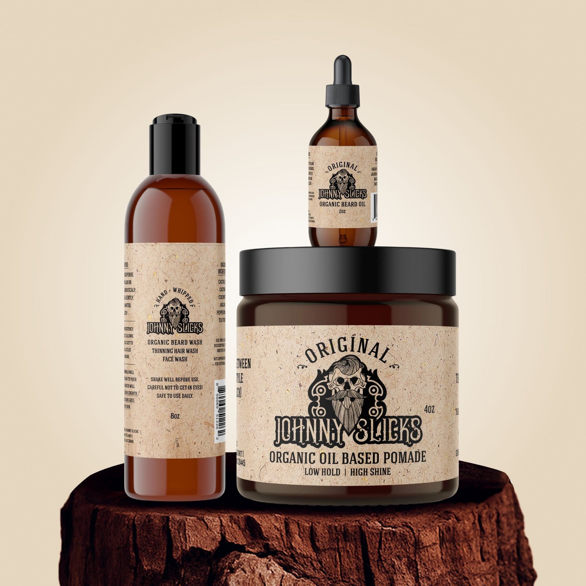 Johnny Slicks Thinning Hair Kit featuring organic beard wash, oil-based pomade, and beard oil on a wooden display base.