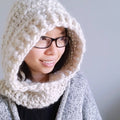 Cozy cream-colored scoodie made from thick and thin wool yarn.