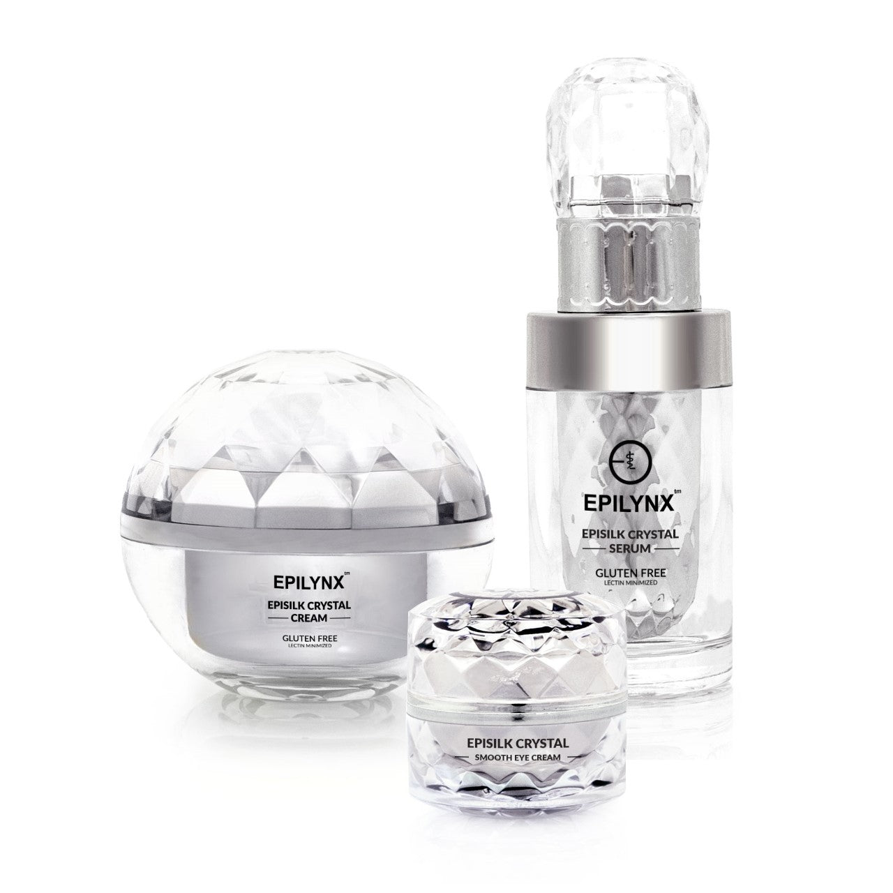 Three-piece Epilynx Episilk Crystal skincare set including serum, moisturizer, and eye cream in elegant glass packaging.