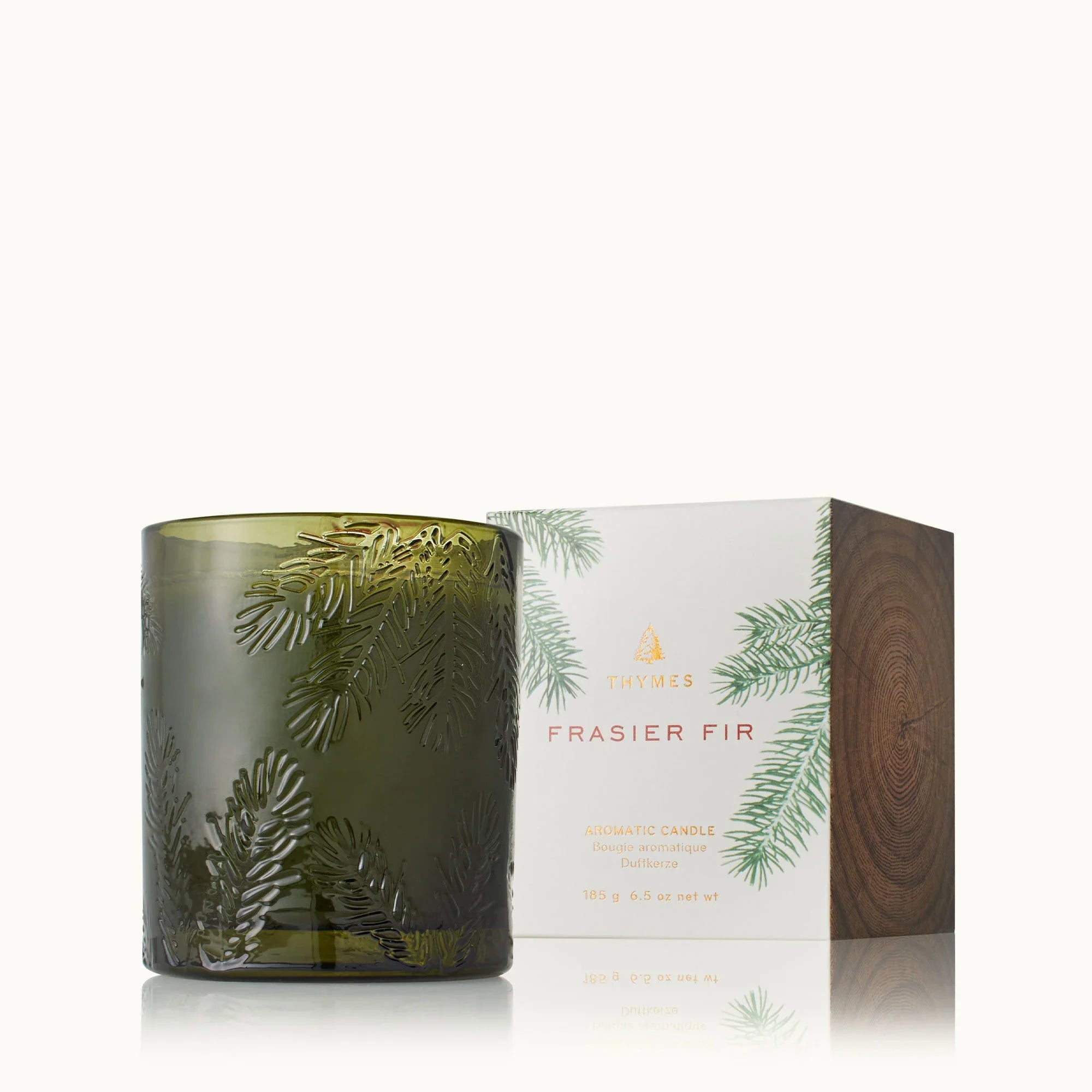 Artisan green glass candle featuring the Frasier Fir scent.
