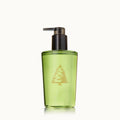 Thymes Frasier Fir hand wash bottle in seasonal green and gold packaging