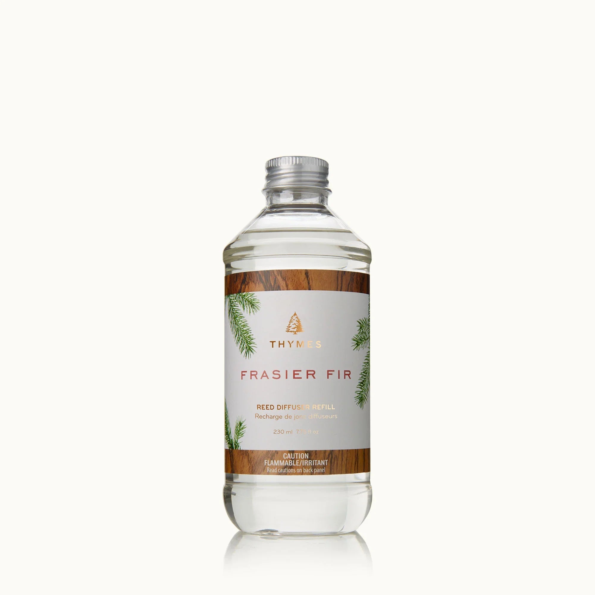 Thymes Frasier Fir 7.75 oz reed diffuser oil refill bottle with forest green, gold, and white label