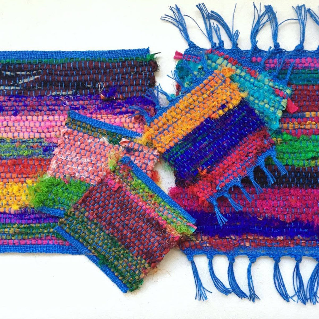 Close up of woven Tibet Jewels coasters and trivets featuring vibrant silk ribbon yarn texture.