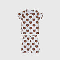 Child wearing a white and orange tiger print bamboo short set with biker style shorts