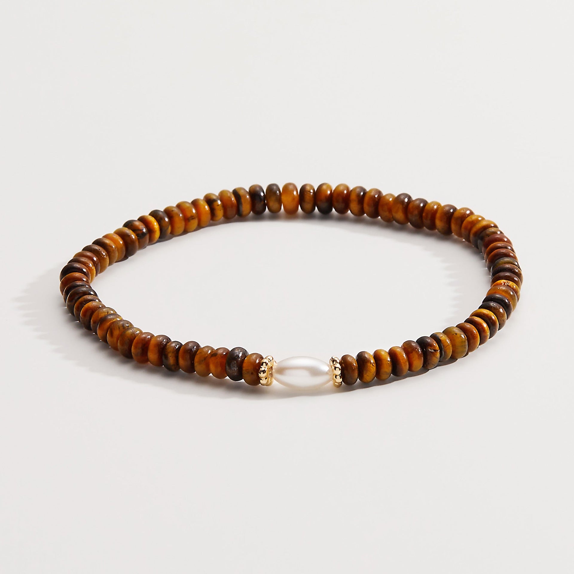 Tiger's Eye and white pearl stretch bracelet with a bohemian minimalist design