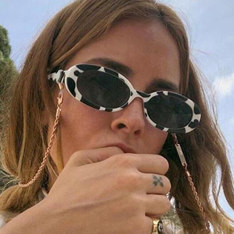 Elegant small 90s retro oval sunglasses for women in various colors.