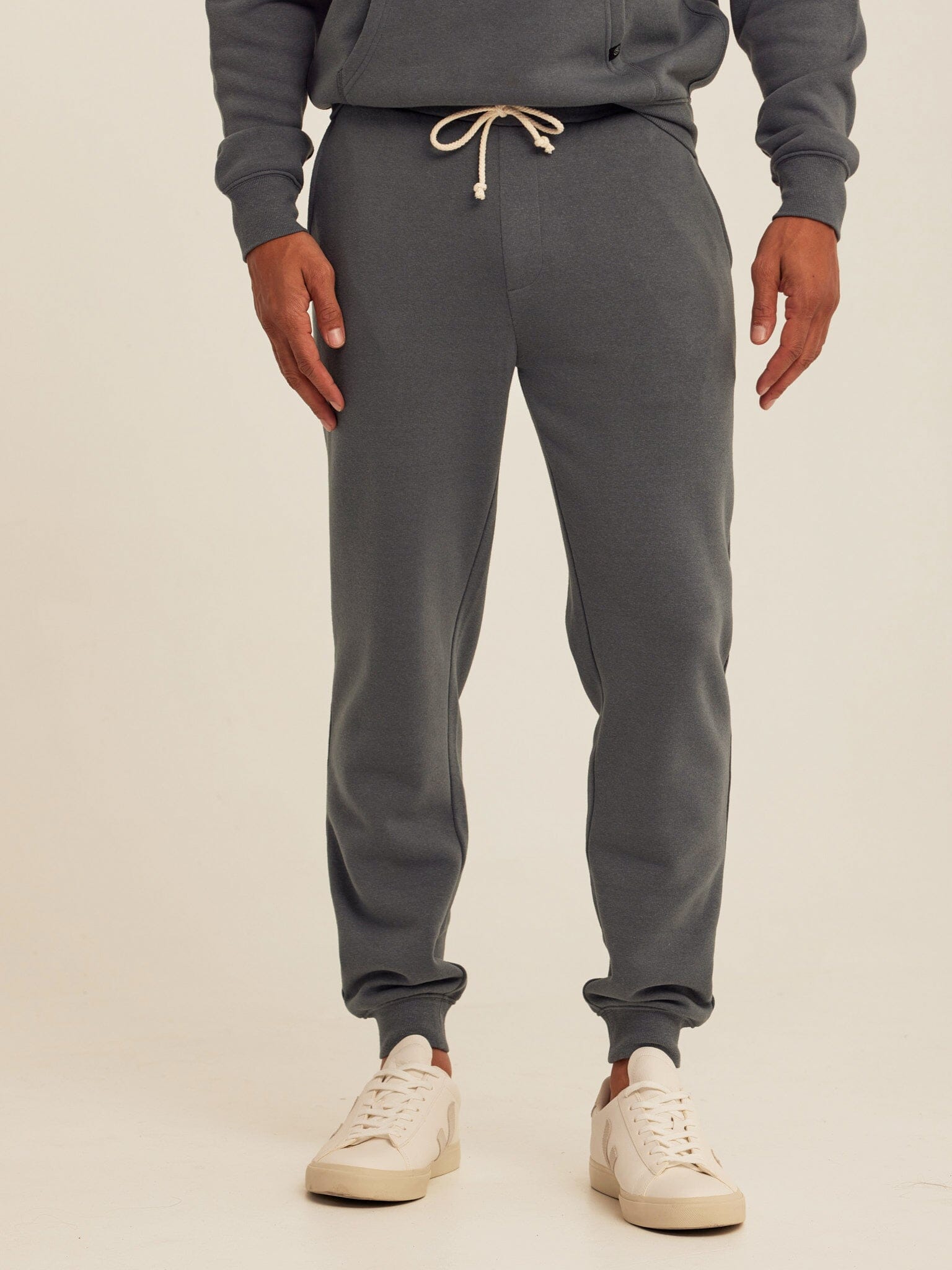 Men wearing Charcoal Grey Core Triblend Fleece Joggers with a modern tapered silhouette