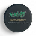 A 3.4oz container of Tomb 45 Indestructible Hair Styling Clay with a matte finish label.