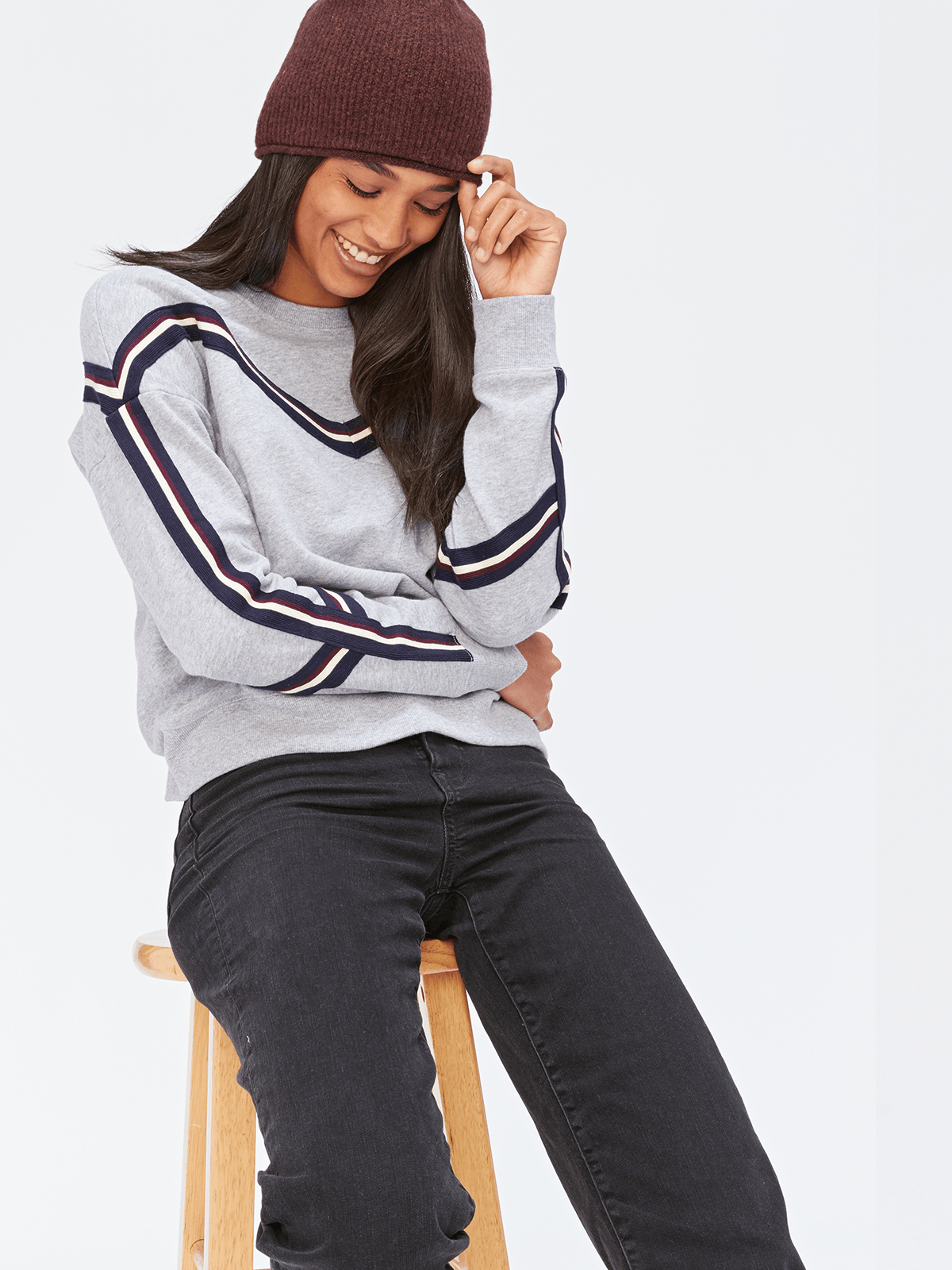 Toni Pullover with unique stripe trim detail worn as a cozy long-sleeve knit sweater