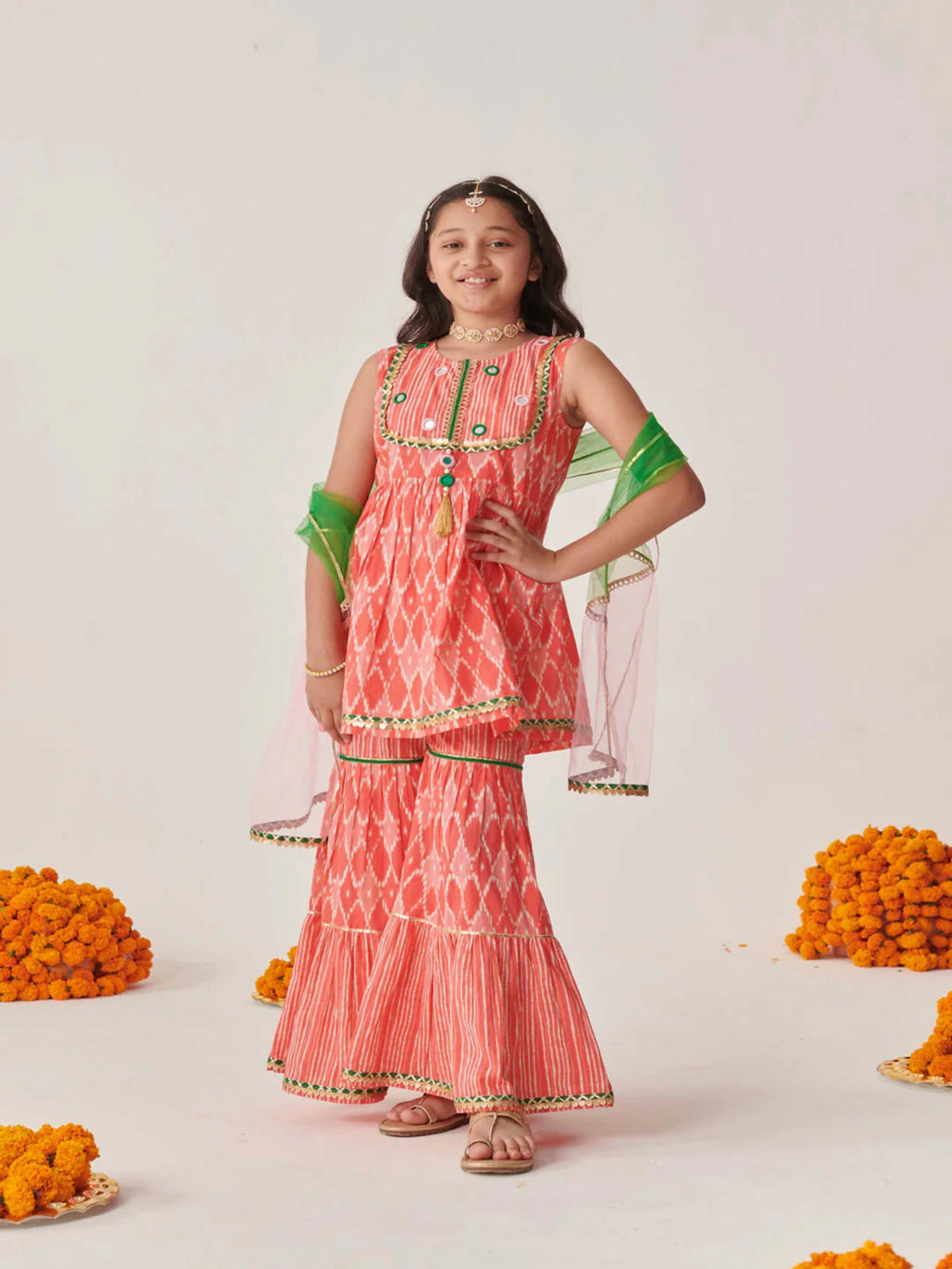 Girl's peach cotton blend sharara set with decorative net dupatta