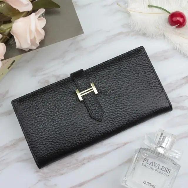 Vintage style genuine leather wallet for women and girls featuring a metal snap closure.