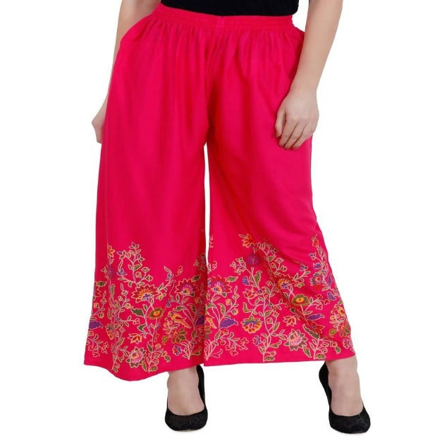 Magenta palazzo pants with a delicate floral print and a relaxed, wide-leg fit.