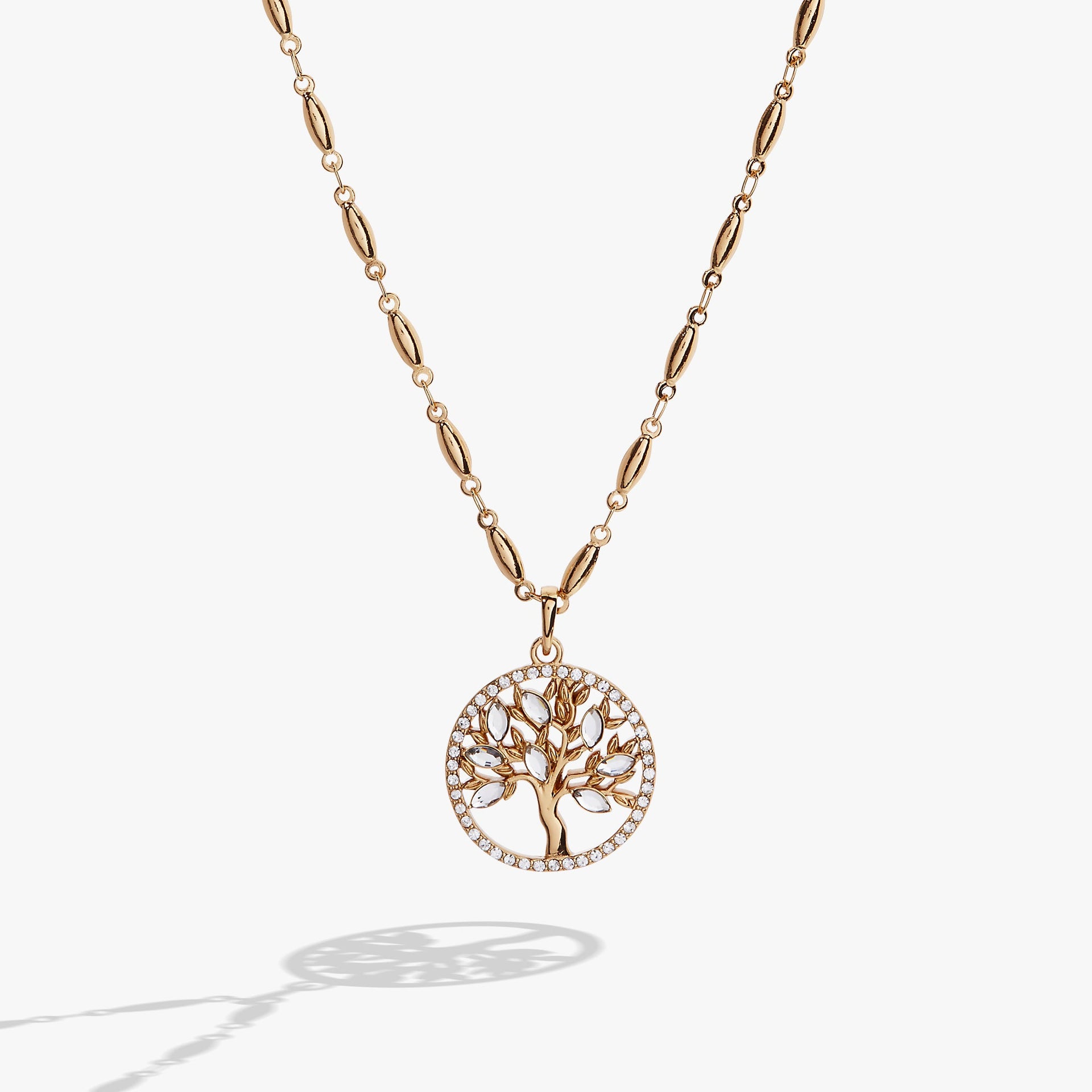 Faith and Family Tree of Life pendant featuring crystal accents on an expandable chain.