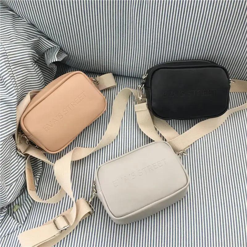 Trendy designer leather messenger bag with flap closure and long shoulder strap