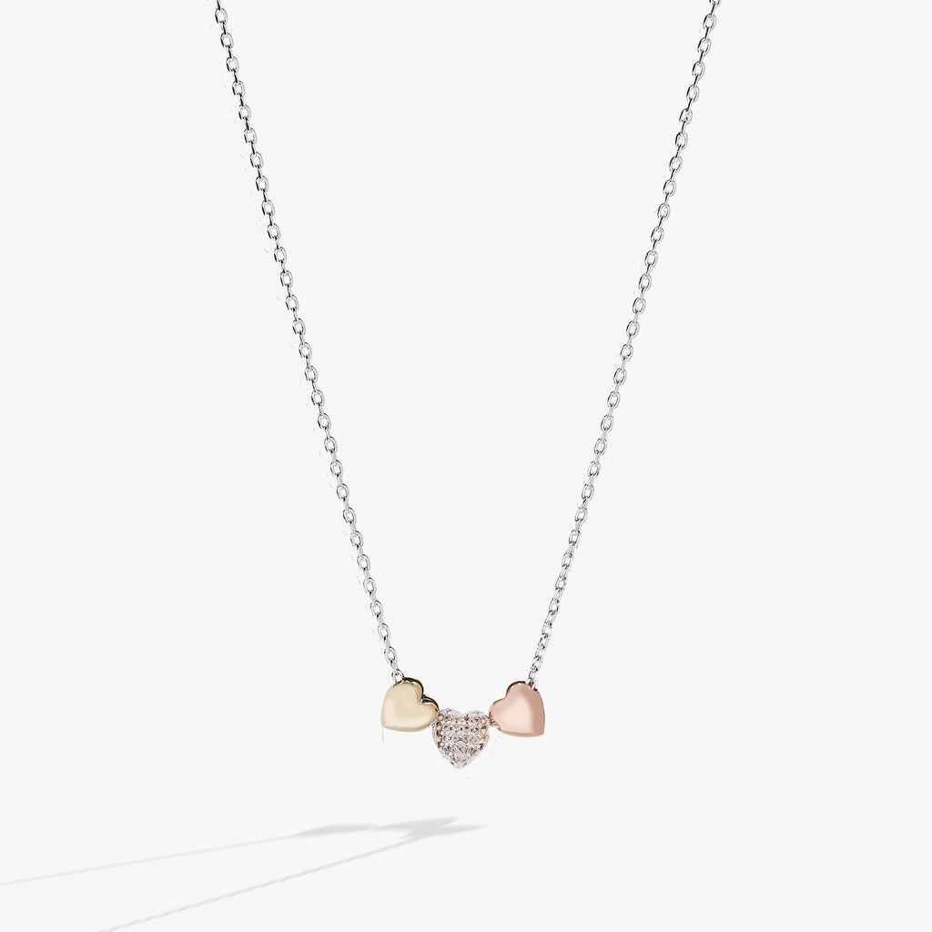 Tri-tone heart slider pendant necklace with clear crystals on an adjustable chain