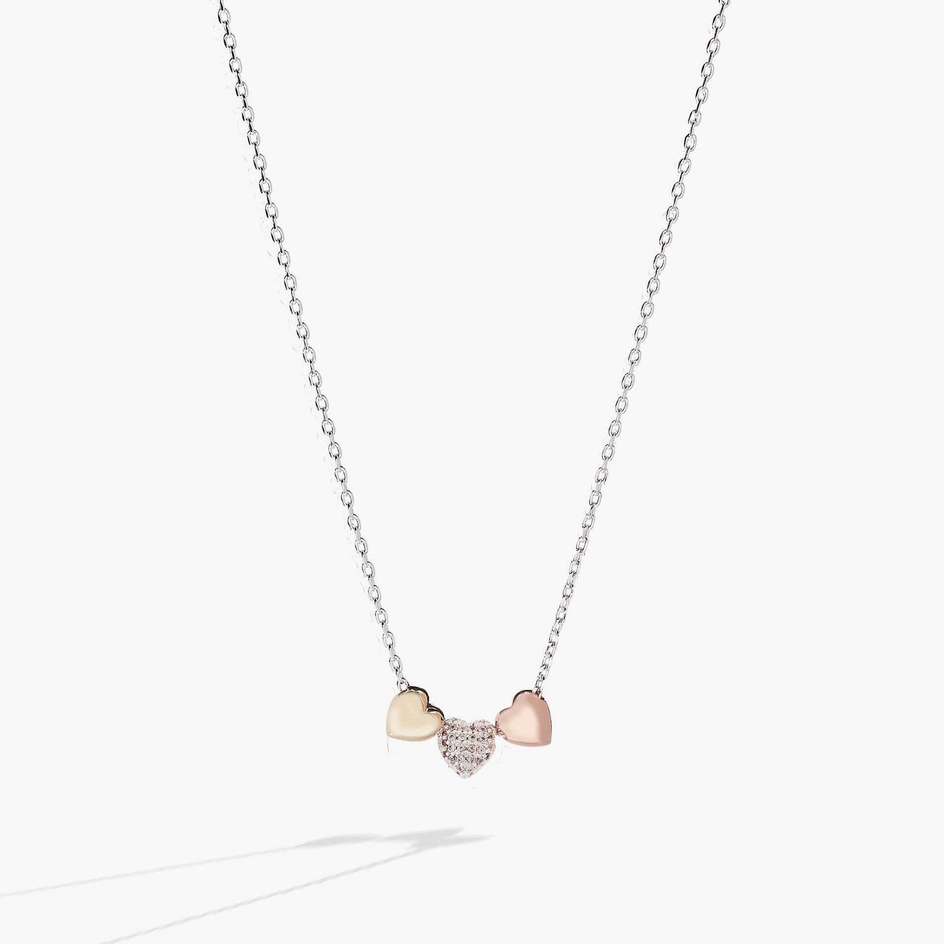 Tri-tone heart slider pendant necklace with clear crystals on an adjustable chain