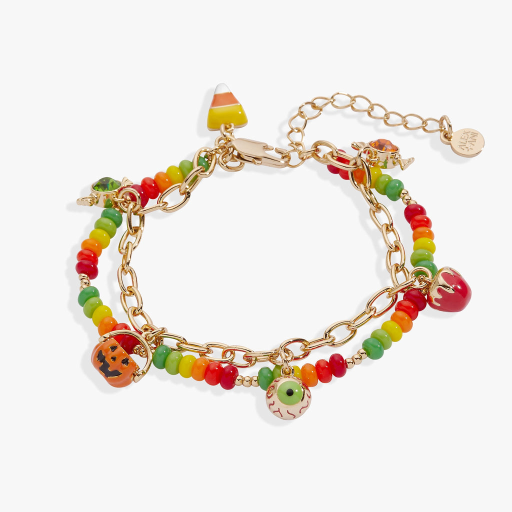 Trick or Treat charm bracelet featuring colorful jack-o’-lantern and candy charms with gold-tone accents.