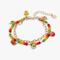 Trick or Treat charm bracelet featuring colorful jack-o’-lantern and candy charms with gold-tone accents.