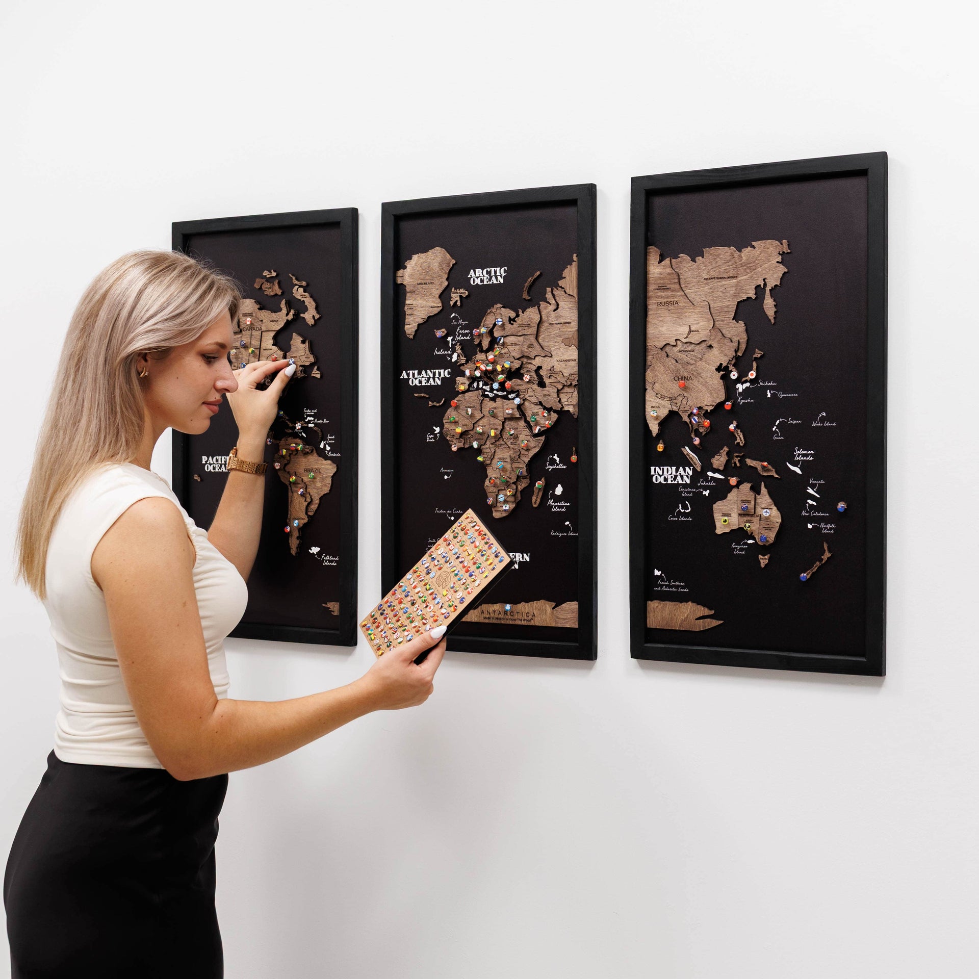 Triptych Wooden World Map in Dark Walnut showing three panels arranged on a wall