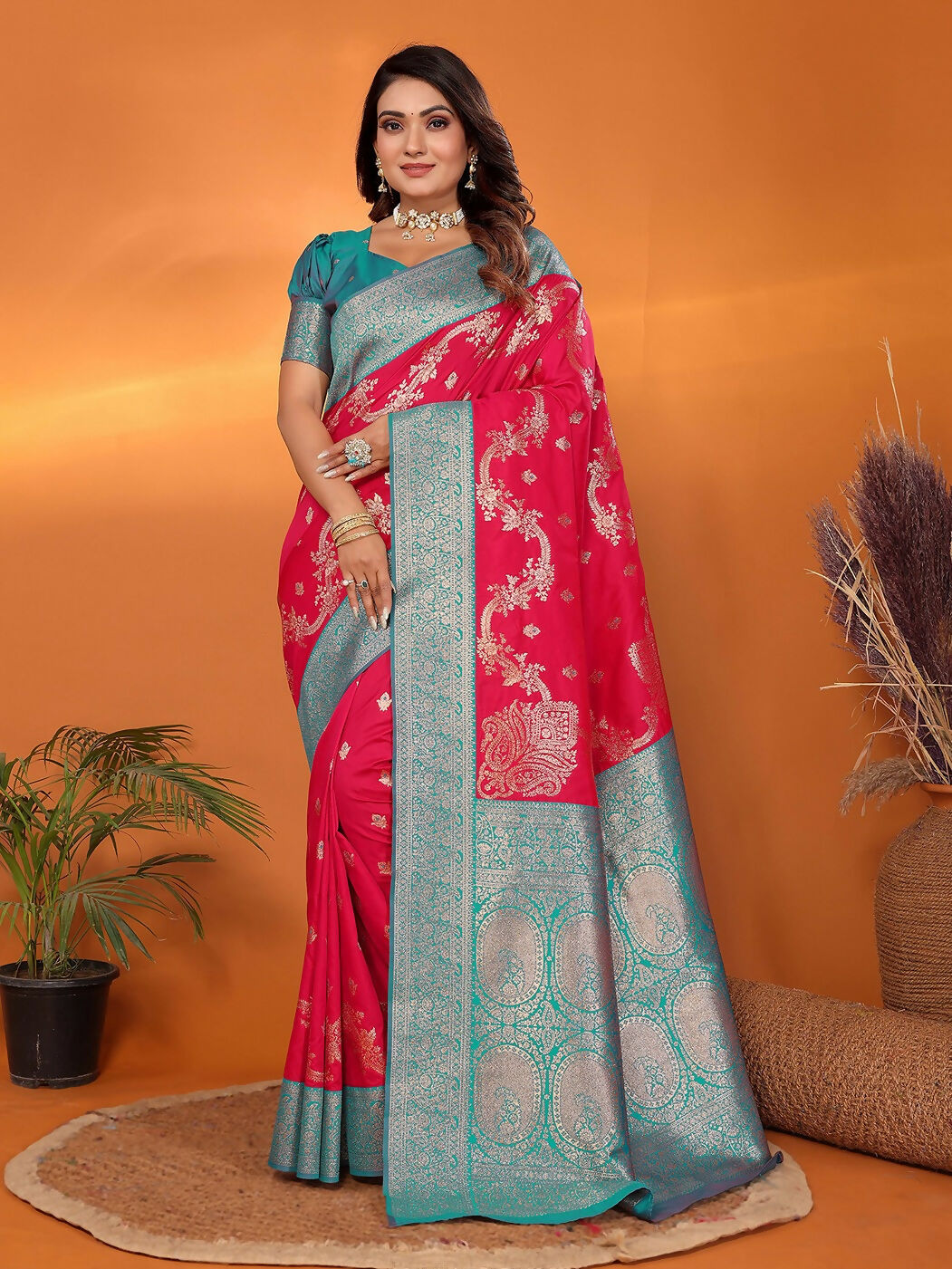 A beautiful red Banarasi saree in soft silk with intricate woven patterns and matching blouse piece.