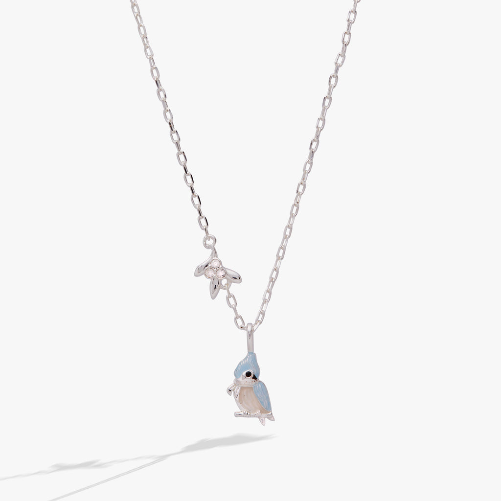 Silver tufted titmouse bird pendant necklace with blue-grey enamel and crystal-accented mistletoe