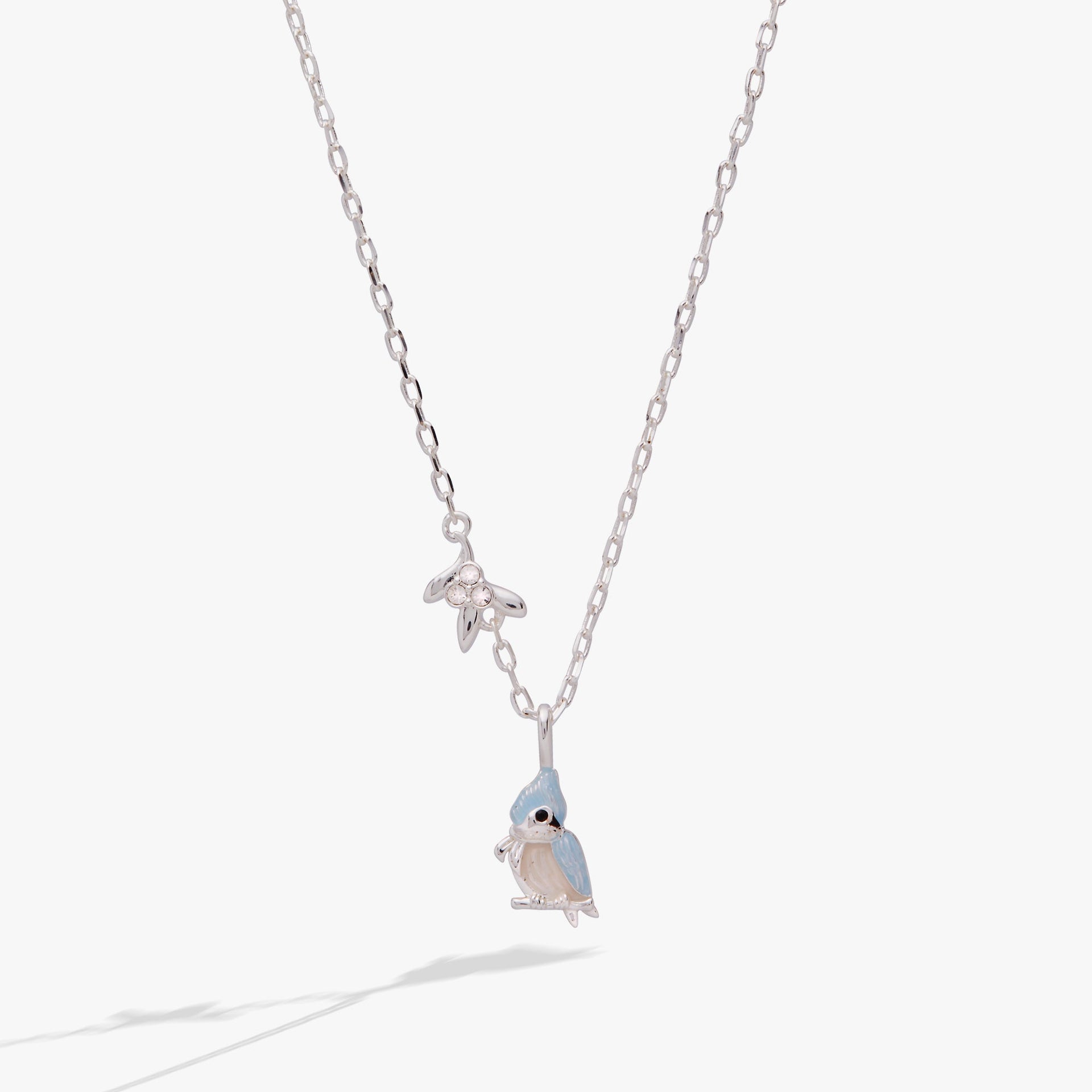 Silver tufted titmouse bird pendant necklace with blue-grey enamel and crystal-accented mistletoe