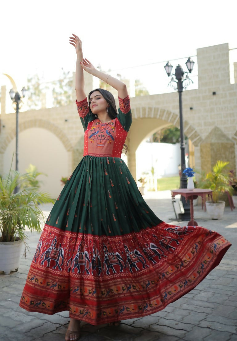 Bottle green floor-length Anarkali dress featuring traditional Patola and foil print