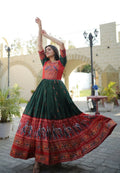 Bottle green floor-length Anarkali dress featuring traditional Patola and foil print
