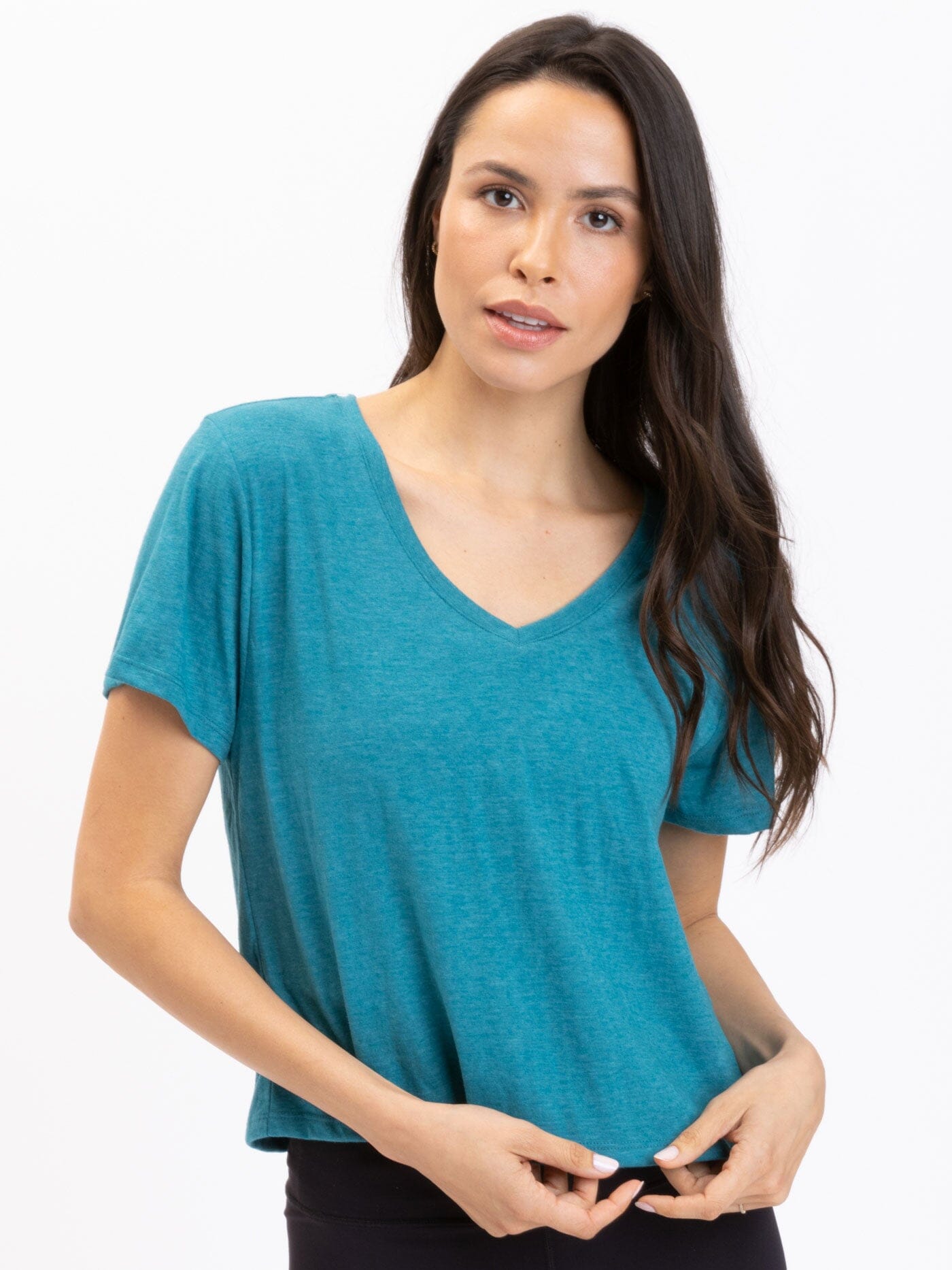 Model wearing a soft teal Triblend Jersey V-Neck tee with a casual minimalist look
