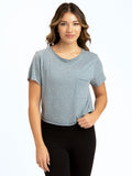 Woman wearing a blue-grey Maggie triblend tee with a high-waist fit.