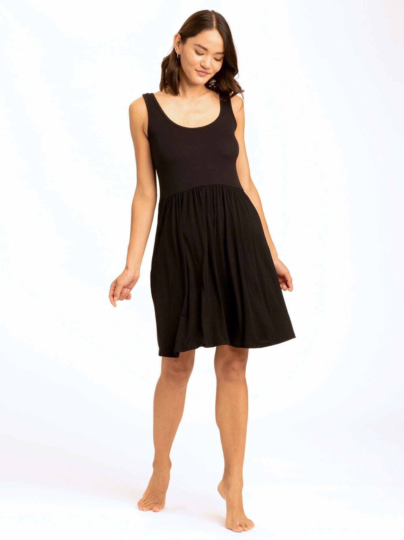 Alivia Scoop Neck Dress featuring a ribbed bodice, jersey skirt, and side pockets in a casual swing silhouette.