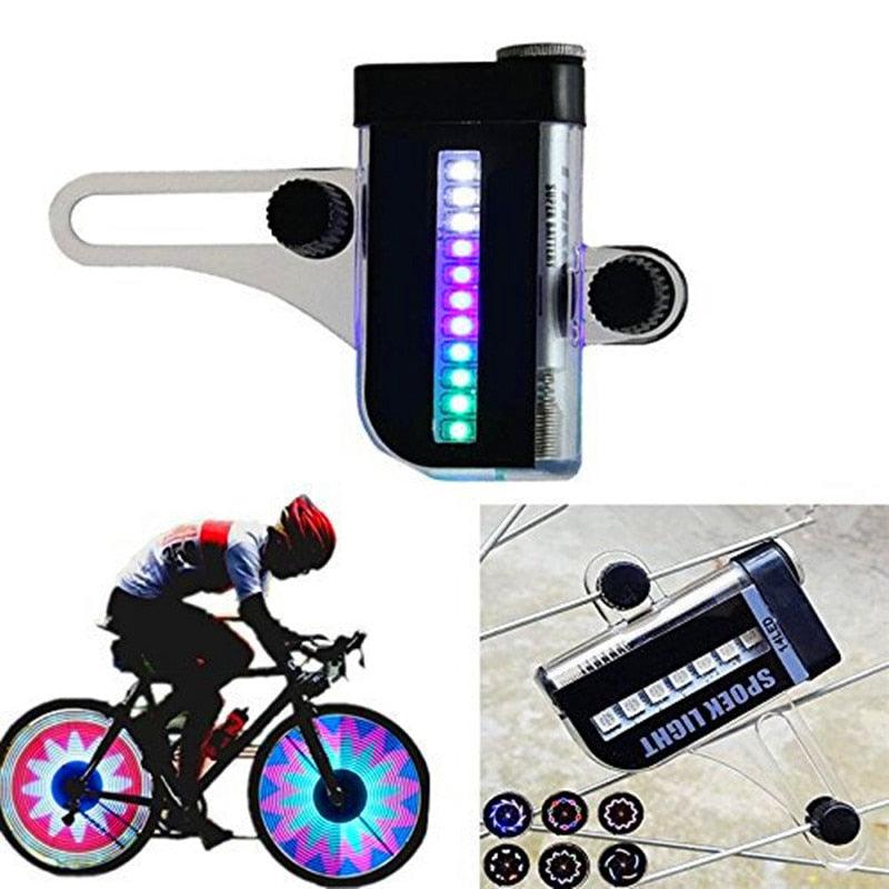 Multicolor LED spoke light attached to a bicycle wheel showing glowing patterns