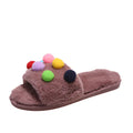 Women's fuzzy house slippers with colorful pom pom details, shown in brown and black colorways