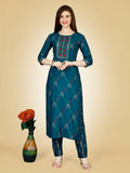 Women wearing a teal straight-cut embroidered kurta and matching pant set in rayon fabric