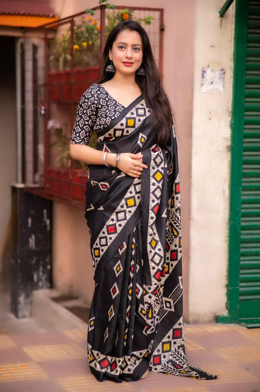 Black Silk blend saree with ethnic batik style prints and matching blouse