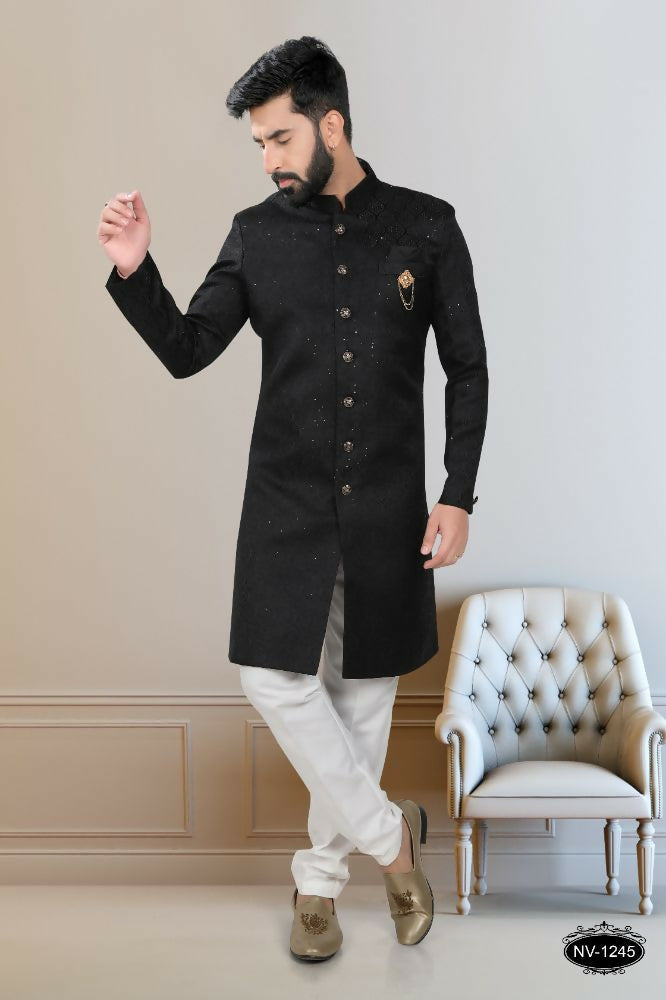 Black Indo-Western kurta for boys featuring heavy all-over sequence embroidery and matching pyjama.