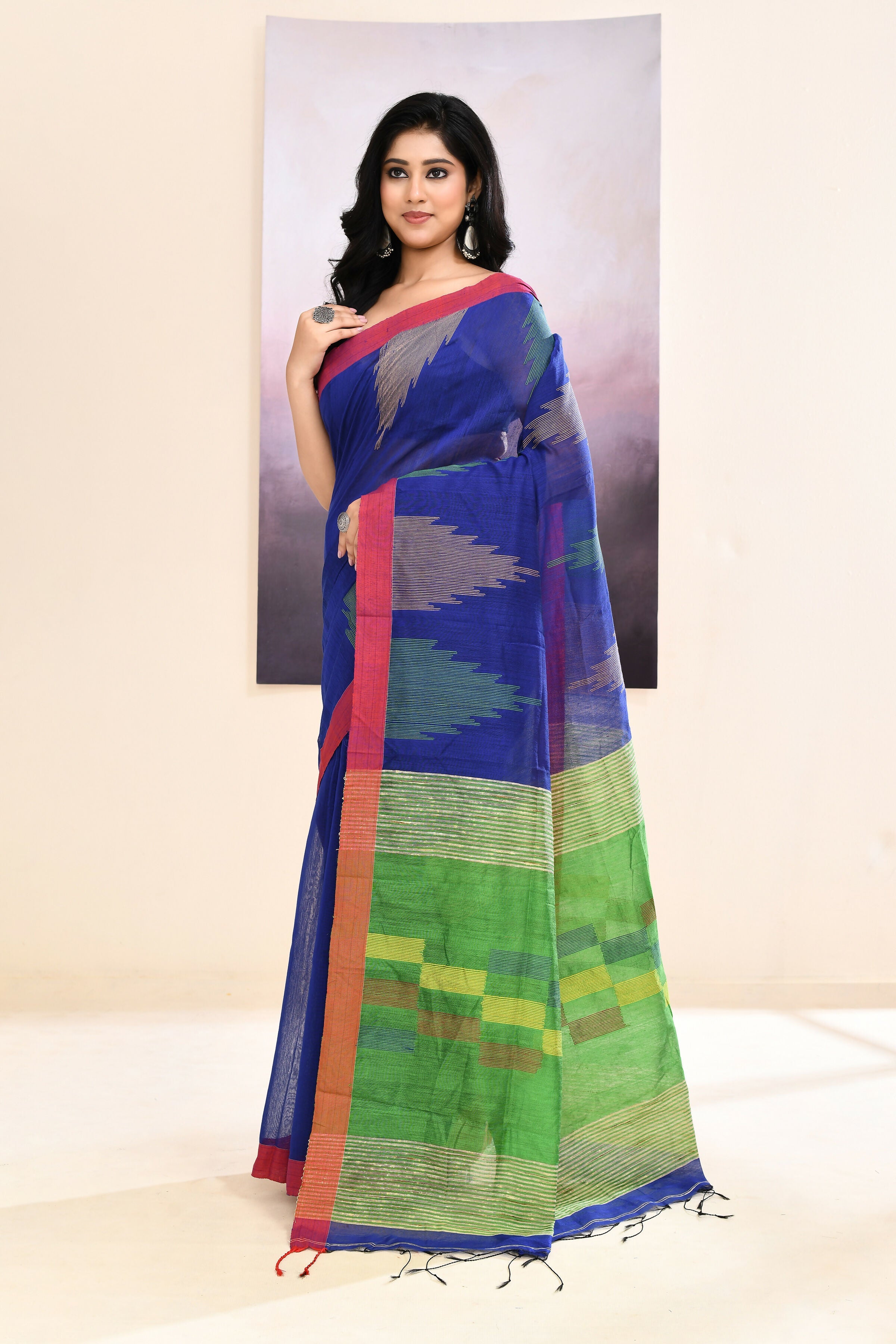 Blue Jamdani saree with traditional temple border and detailed embellishments