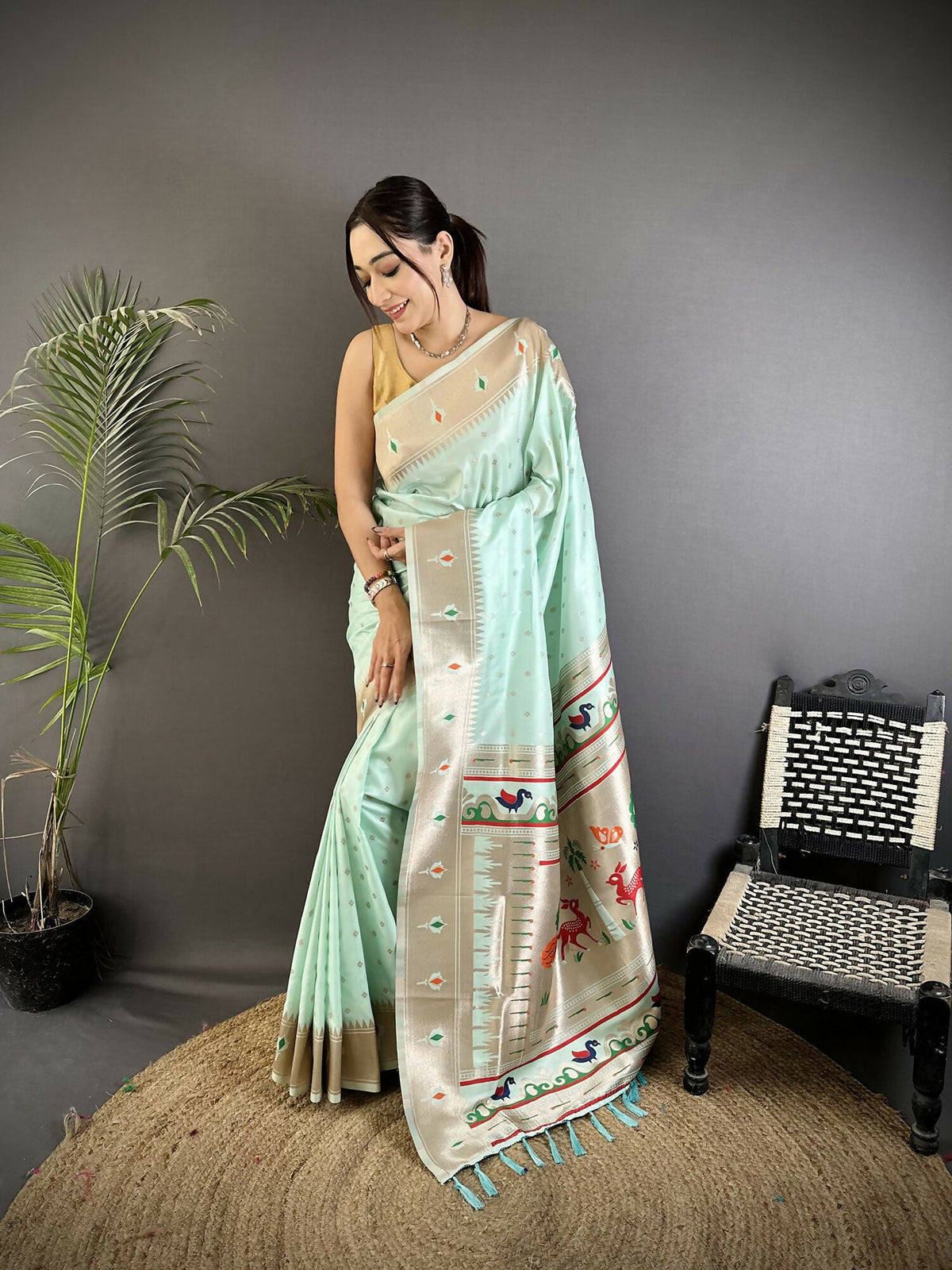 Sea Green soft Lichi silk Kanchipuram saree with detailed peacock and floral motifs