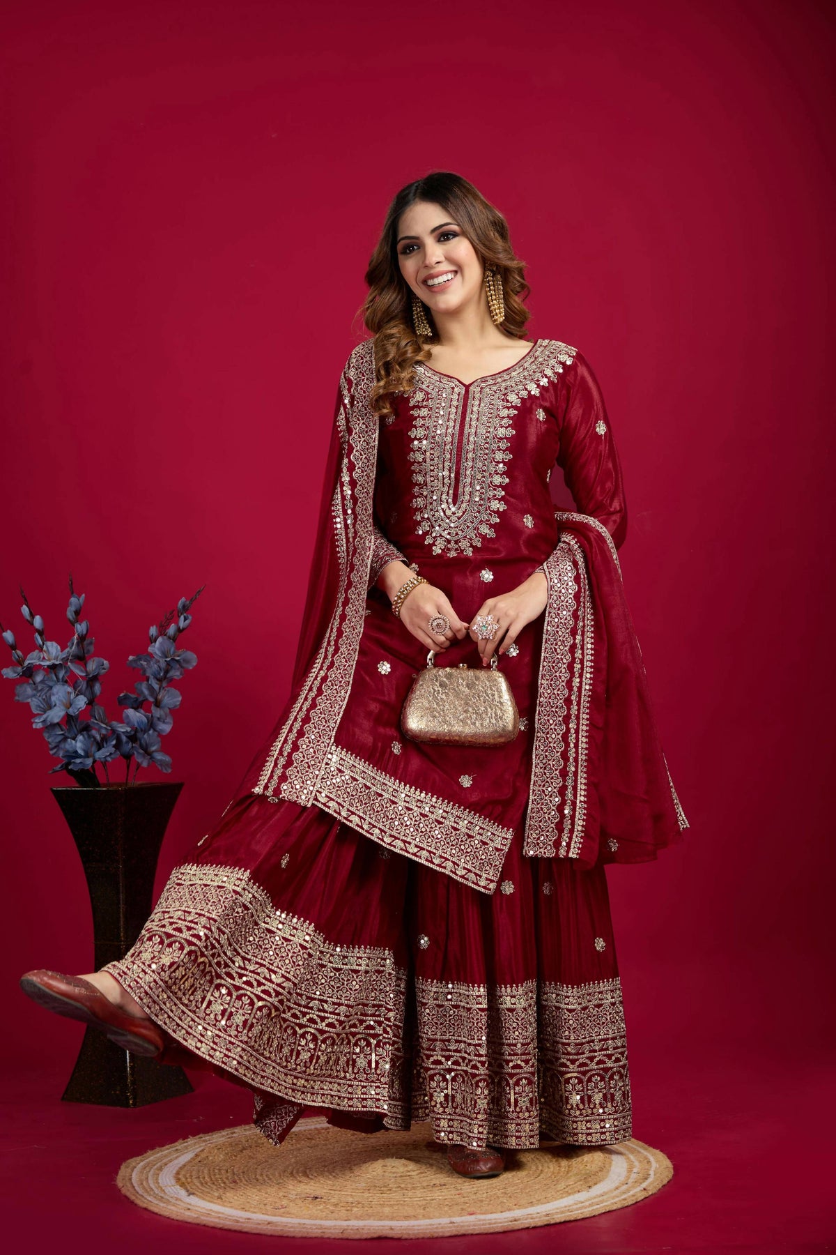 Elegant maroon silk kurta set featuring intricate sequins, zari, coding, and thread embroidery.