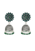 Close-up view of silver-plated Joharkamal Kundan Jhumka earrings with vibrant green bead accents