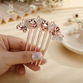 Rose gold metal hair comb featuring a delicate floral design