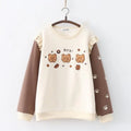 Women's crew neck fleece-lined pullover sweater featuring cartoon bear embroidery and paw print sleeves.