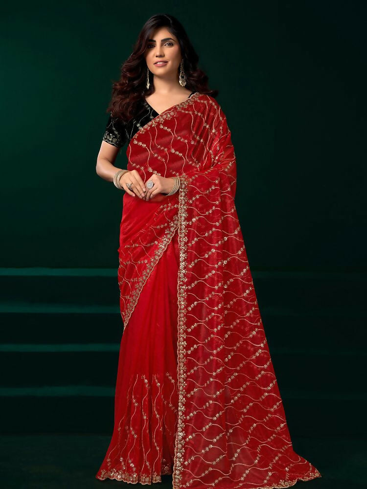 Beautiful red net saree with a contrasting black velvet blouse for parties.