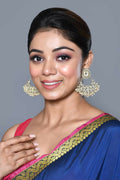 Traditional golden white Kundan and pearl earrings for ethnic wear.