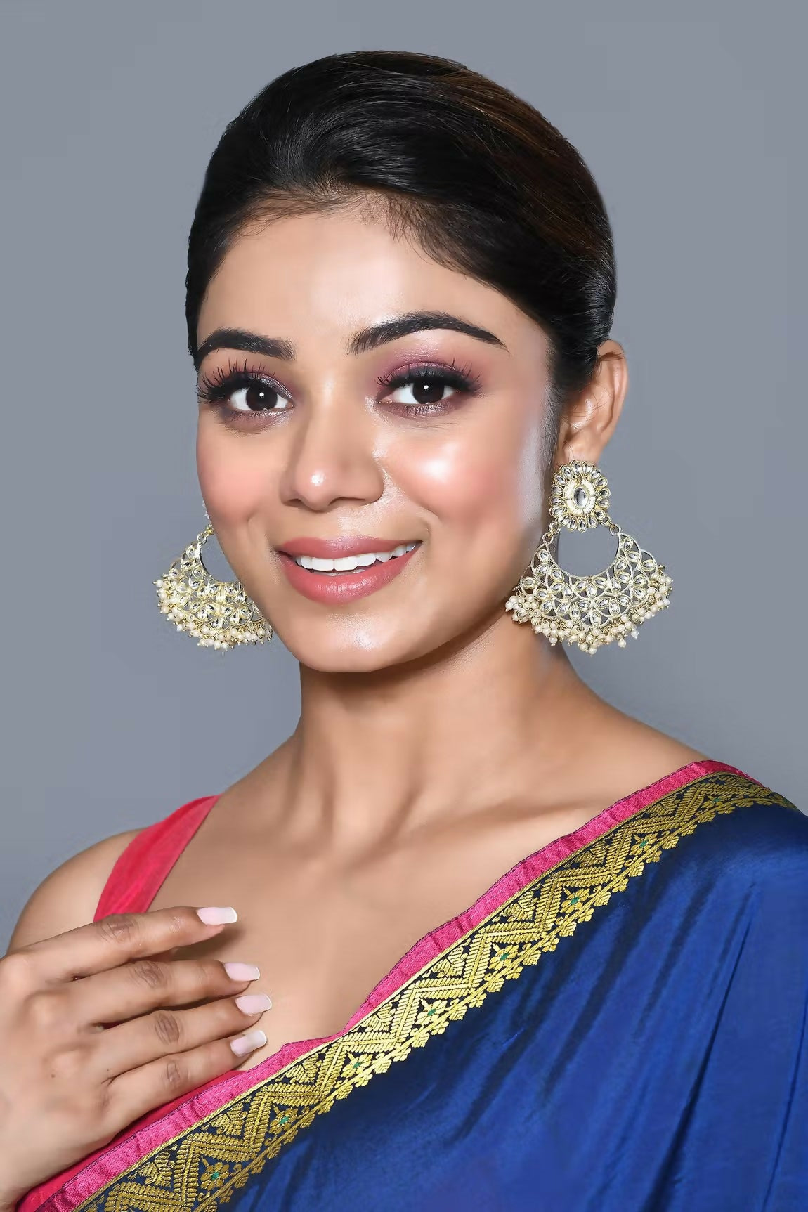 Traditional golden white Kundan and pearl earrings for ethnic wear.