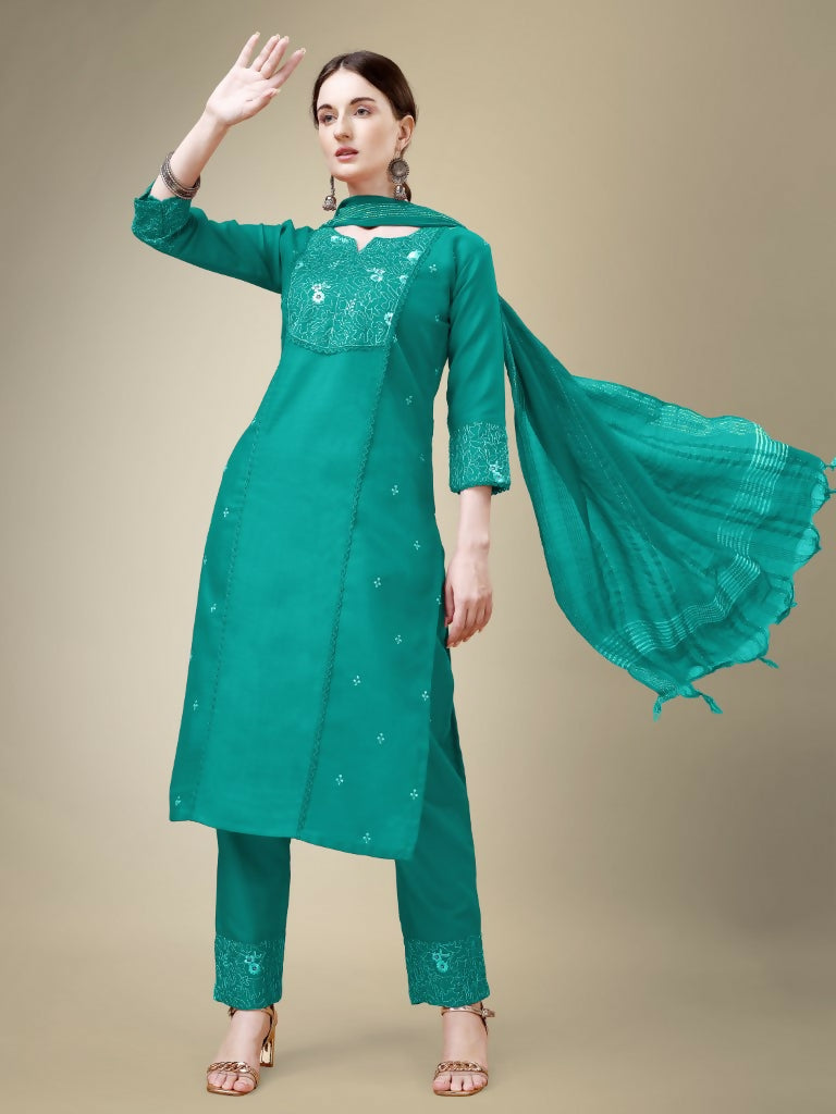 Women wearing a Rama colored straight cotton blend kurta with embroidery and lace work, paired with trousers and dupatta.