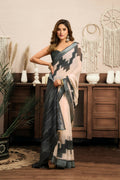 White and grey linen saree with ethnic motifs, paired with a dark grey unstitched blouse piece.
