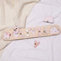 Personalized wooden name puzzle featuring a unicorn theme for kids playroom