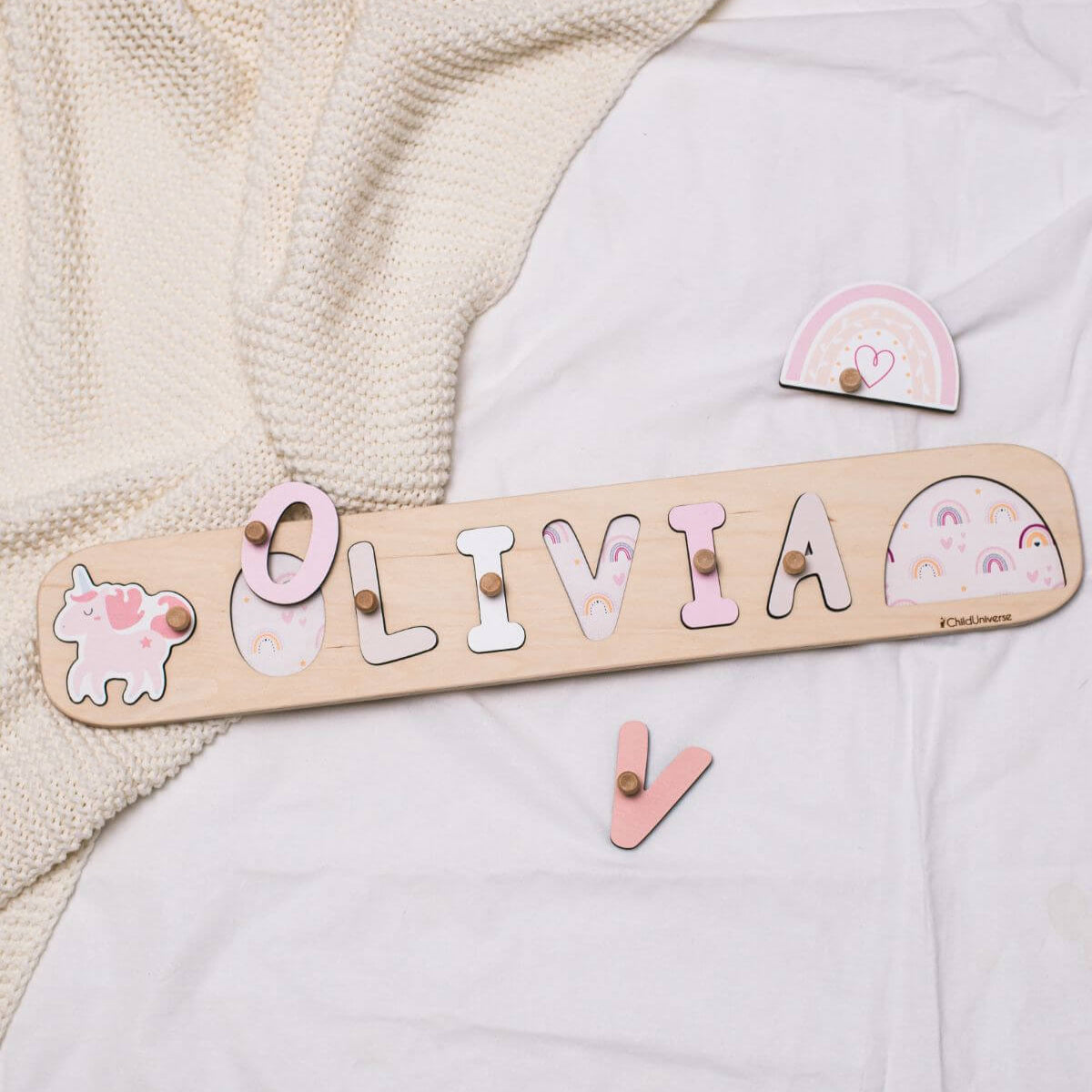 Personalized wooden name puzzle featuring a unicorn theme for kids playroom
