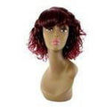 A woman wearing a modern, burgundy red Unique Cassandra synthetic wig.
